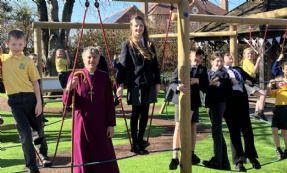 Bishop of Worcester with pupils on the new play area